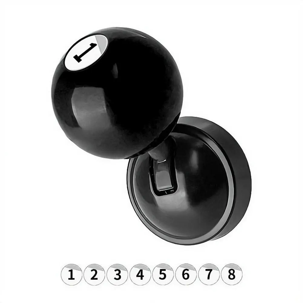 A close-up view of a black car start button joystick with numbered indicators.