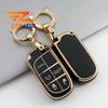 Gold-toned TPU car key case cover with a panic button and various vehicle keys.