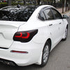 A white sedan with a black tint on the roof and taillights, showing a vinyl decal for car lights.