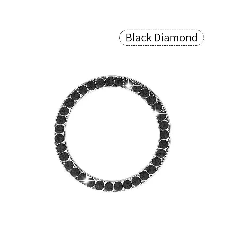 A black diamond decorative ignition push button cover for a car.