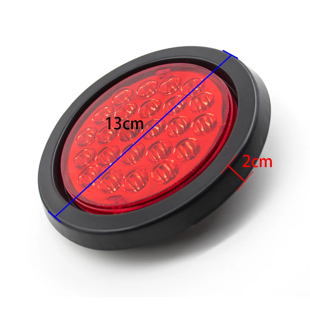 A close-up view of a round LED trailer tail light with brake and turn signal, showing its dimensions.
