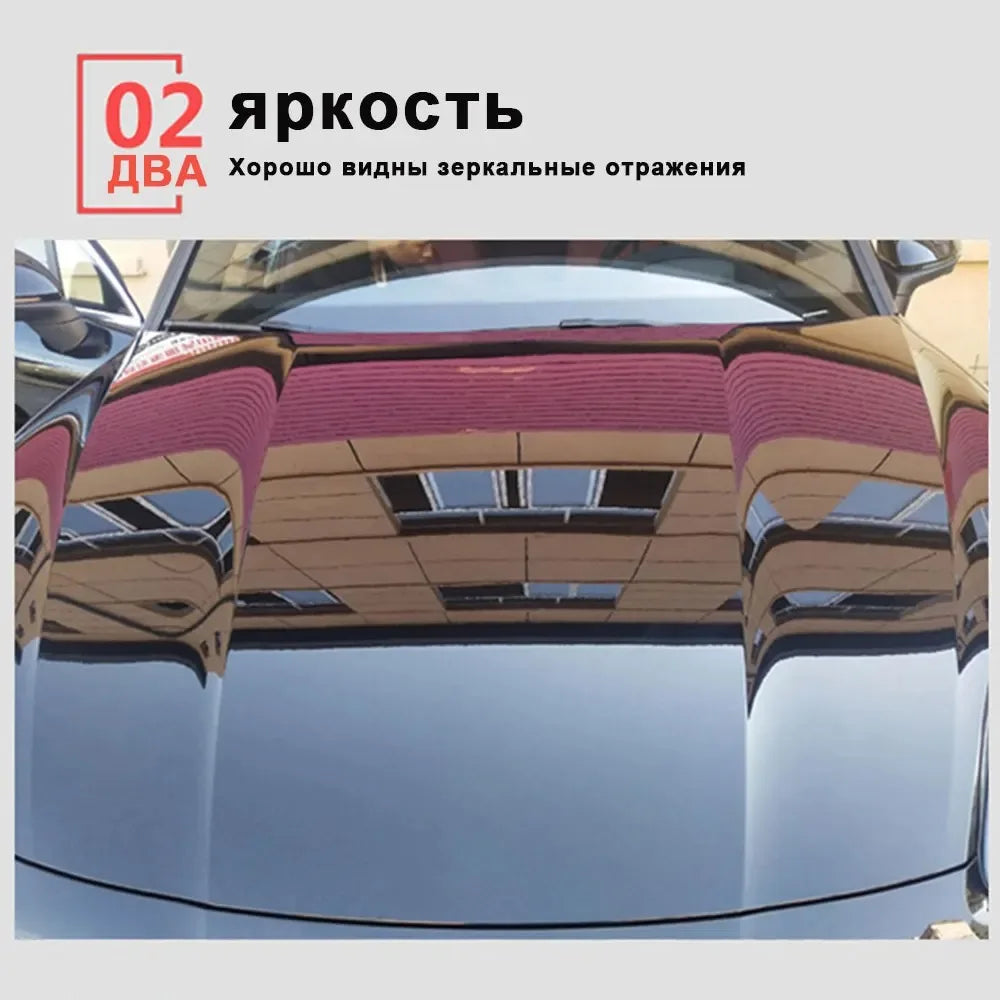 Close-up view of a car's hood showing reflections and a protective ceramic coating application.