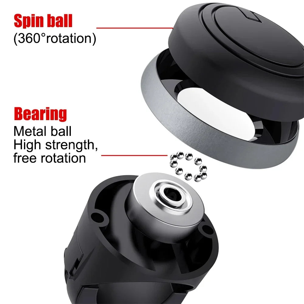 Close-up view of a black universal steering wheel booster knob showing the spin ball and bearing mechanism.