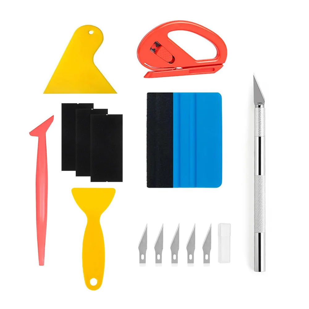 A kit of professional automotive film installation tools including a red tool, a yellow tool, and a silver knife.