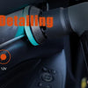 A cordless detailing polisher is shown being used on a car's interior surface.