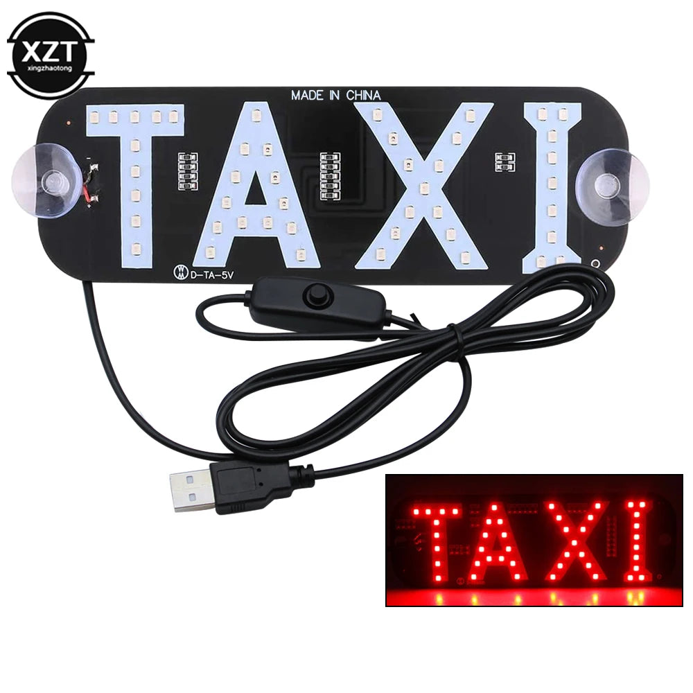 A black LED taxi indicator light panel with illuminated letters TAXI and a connecting cable.