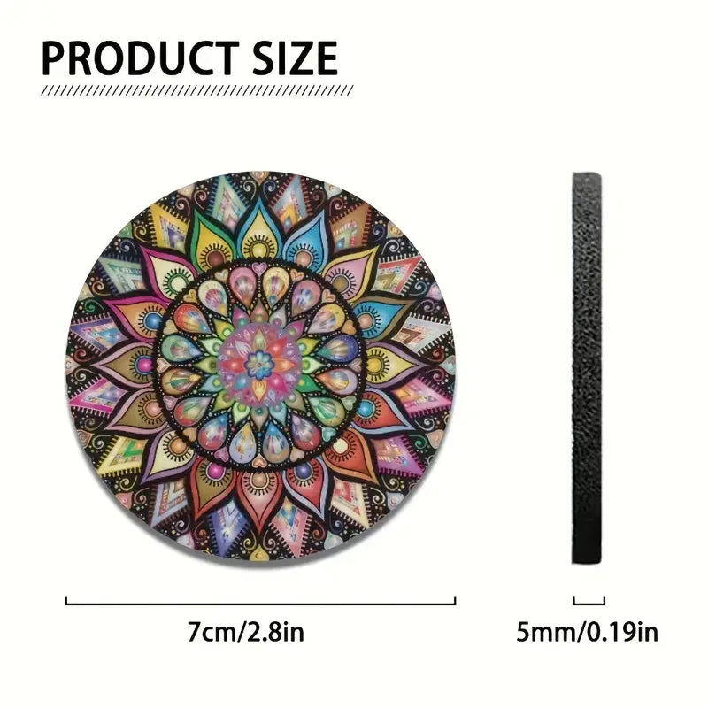 A circular mandala silicone coaster with intricate floral patterns and a black cord.