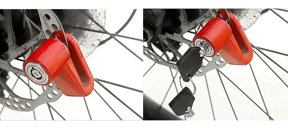 Close-up of a red heavy duty motorcycle wheel disc brake lock attached to a bicycle wheel.