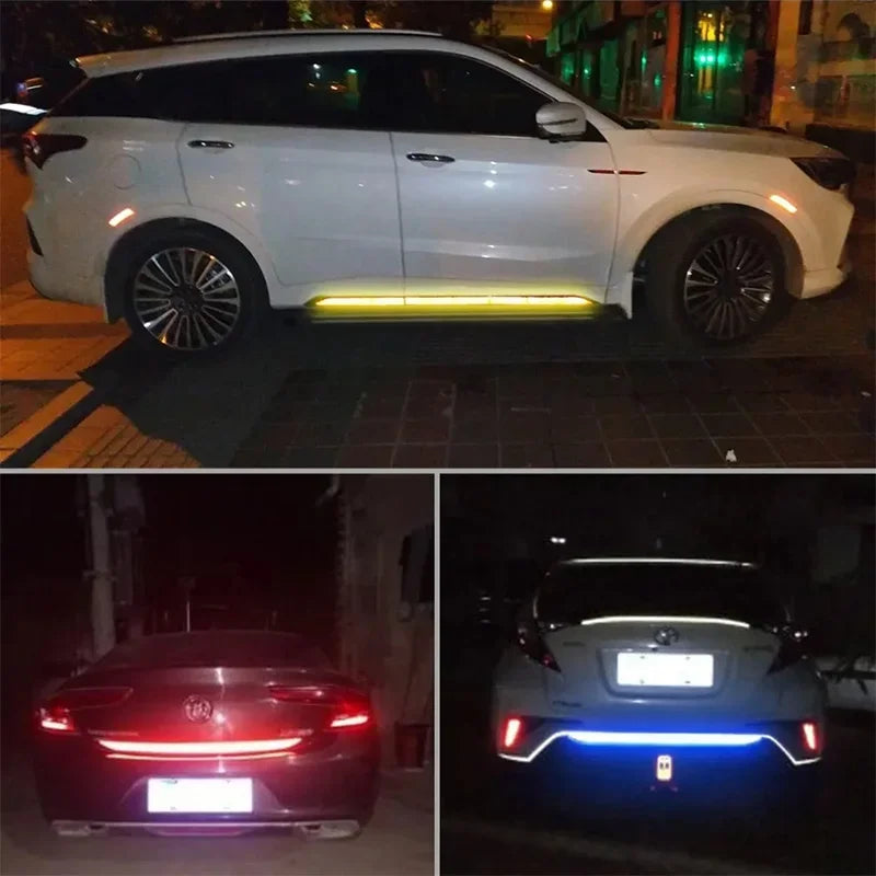 A white SUV with a yellow light bar on the lower bumper and a red car with blue lights in the rear.