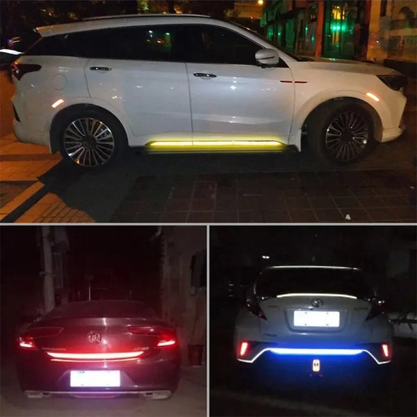 A white SUV with a yellow light bar on the lower bumper and a red car with blue lights in the rear.