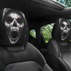 Black car seat headrest covers featuring a skull design with blood splatter and teeth visible.