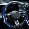 A close-up view of a steering wheel covered in blue and white carbon fiber material.