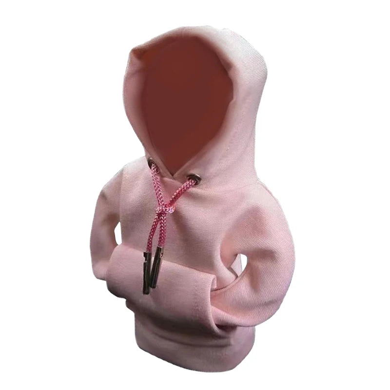 A light pink hoodie cover with a zipper detail and a hood visible.