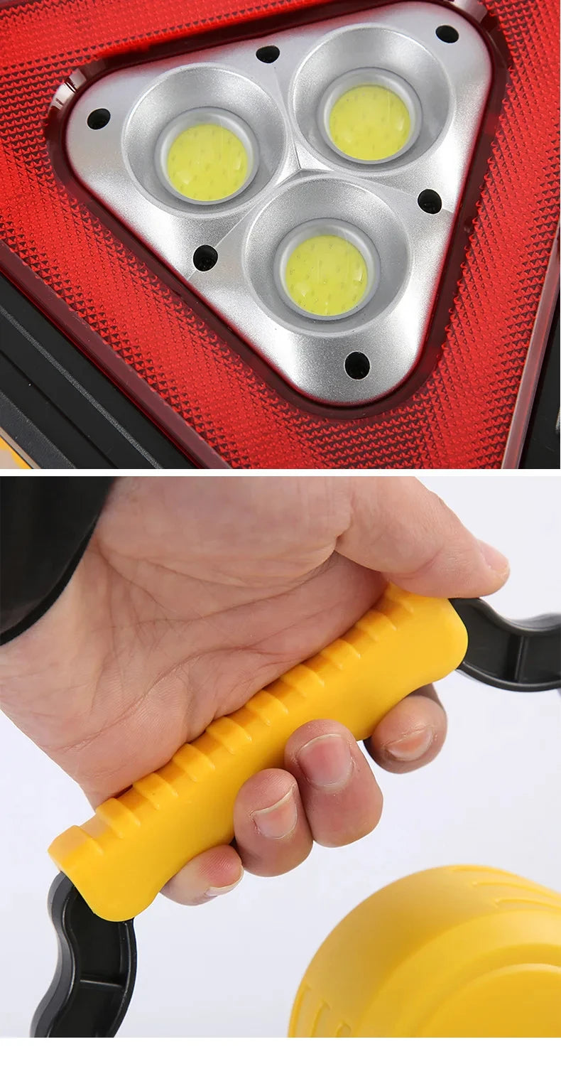 Close-up of a solar emergency warning light featuring three yellow LED lights and a yellow grip handle.