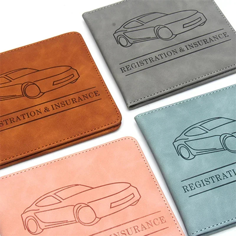 Three leather document holders in brown, gray, and light blue featuring line drawings of cars for registration and insurance.