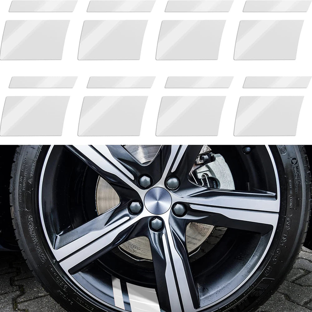 A close-up view of a black alloy wheel with silver accents and tire tread.