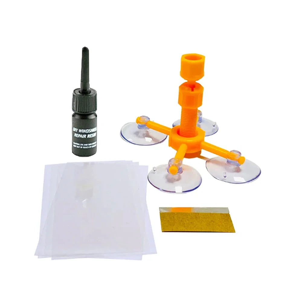 Set an Windschutzscheibenreparaturwerkzeuge, inklusive Reparaturstab, orange Kunststoffteile und Klebefolie.