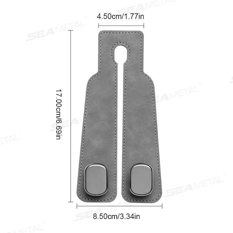 A gray suede car seat back storage hook with a rounded shape and a loop for hanging.