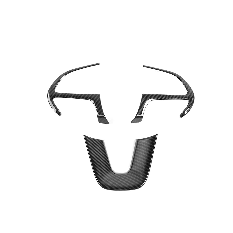 Black carbon fiber steering wheel decoration cover with a stylized face design