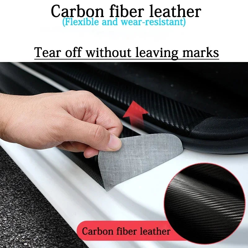 A hand is tearing off a carbon fiber leather door sill protection strip, showing the material's texture.