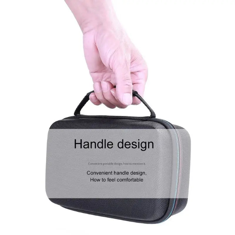 A hand is holding a black protective case designed for a lithium jump starter.