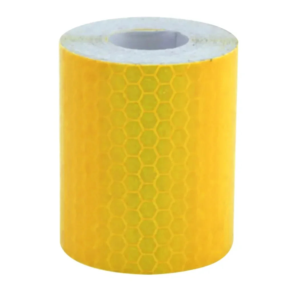 A roll of yellow high-visibility reflective tape for vehicles.