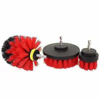 A set of three red and black power scrubber brushes for drill attachments.