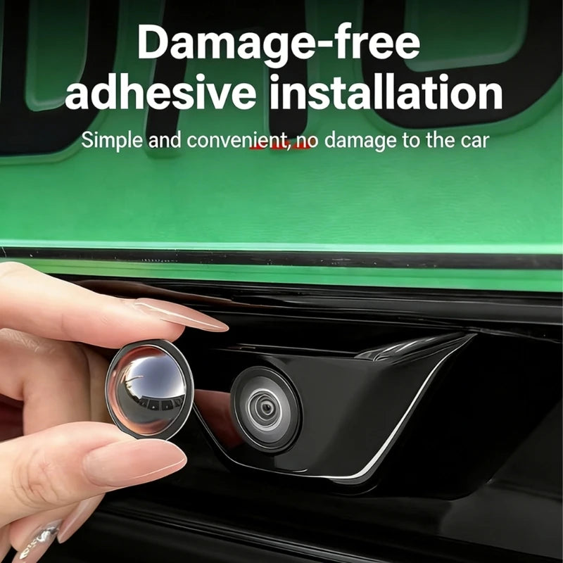 A hand installs a damage-free adhesive lens protector onto a car camera housing.