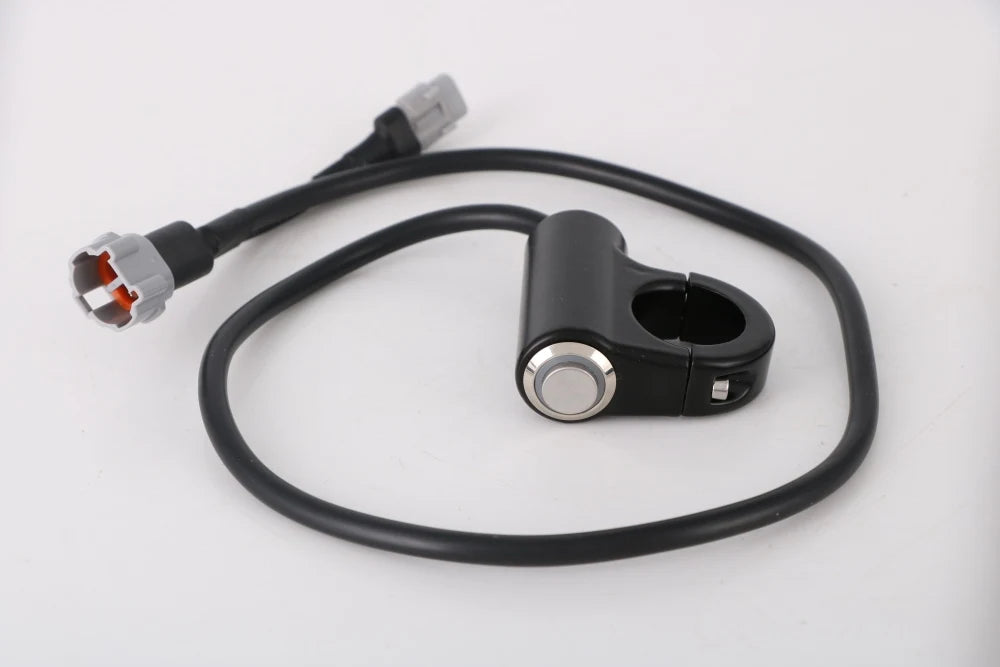 A black plug and play headlight kill switch with a cable is shown on a white background.
