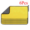 A set of six yellow microfiber car cleaning towels stacked and displayed.