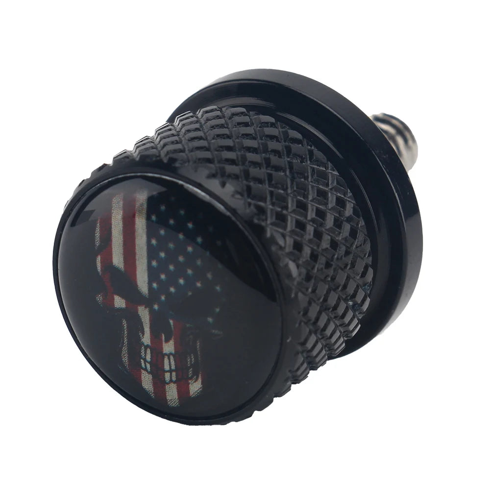Black aftermarket motorcycle seat and fender bolts with a textured surface.