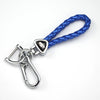 A silver key fob attached to a blue braided leather strap, used as a universal car key case cover.