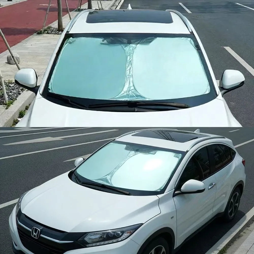 A white Honda HR-V SUV with a tinted windshield sunshade installed.