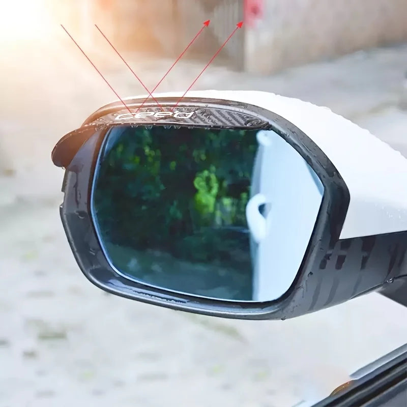 Close-up of a universal carbon fiber rain shield installed over a car's rearview mirror.