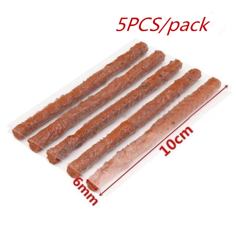 Five pieces of brown natural rubber tire repair strips, 10cm long and 6mm wide, packaged as a pack.