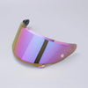 A purple anti-fog visor designed for motorcycle helmets, shown in a slight angle.