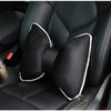 Black ergonomic car headrest pillow with a bow design shown inside a car seat.
