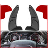 Black CNC aluminum steering wheel paddle shifter mounted on a car dashboard.