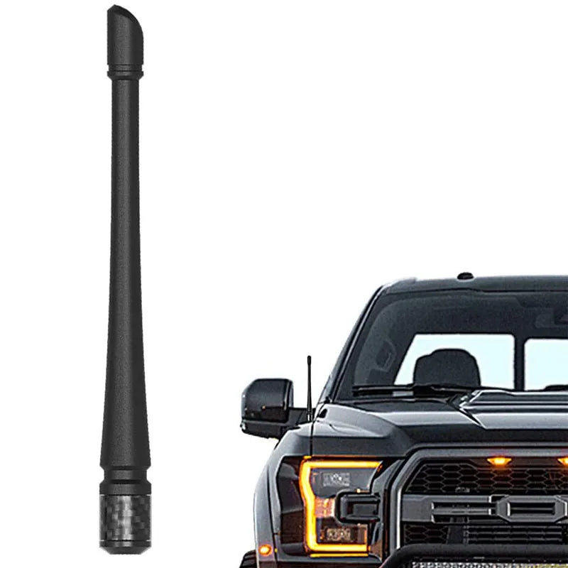 Black universal car antenna for motorcycle and truck mounted on a vehicle grille.