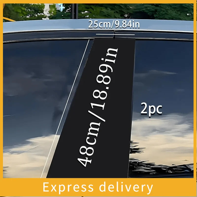 A close-up photo of a black decal set measuring 48cm/18.89in and 25cm/9.84in, shown against a window.