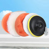 A professional car polishing pad kit showing various colored foam pads and a black spinning pad.