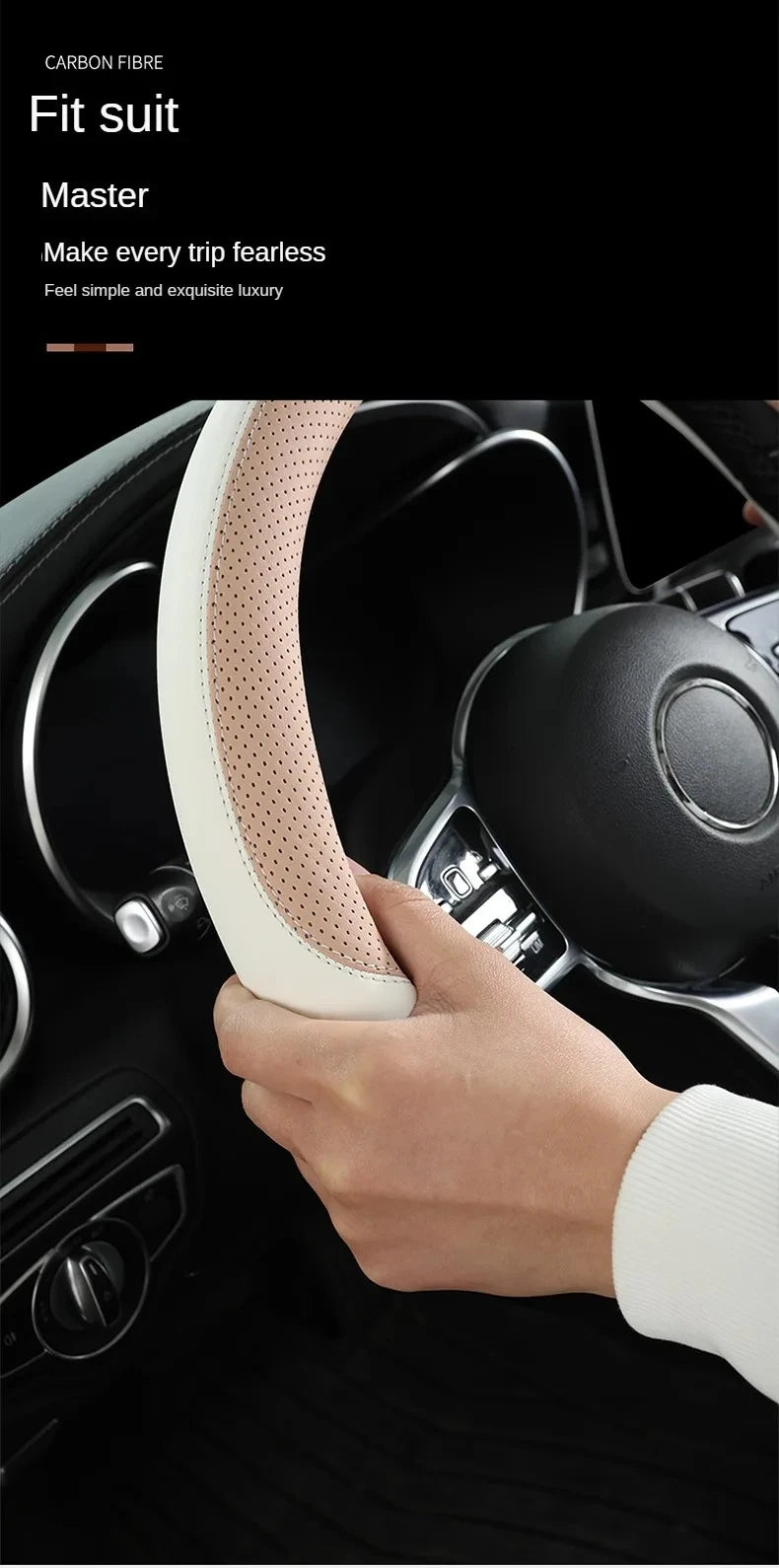 A hand is gripping a light beige perforated leather steering wheel cover inside a dark car interior.