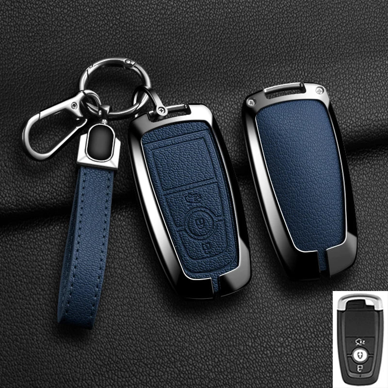 A dark blue aluminum alloy key fob cover with a metal split ring attached to a leather strap and a keyring.