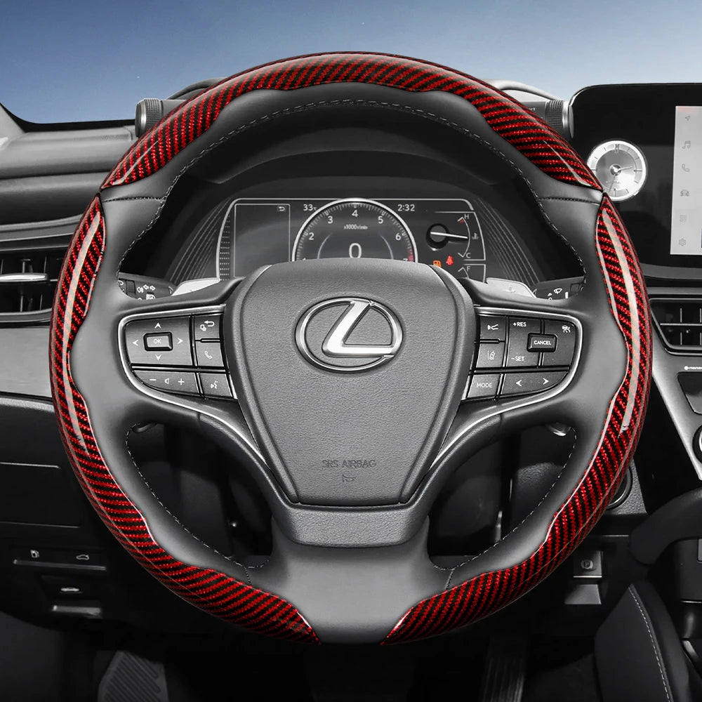 Close-up view of a Lexus steering wheel with black leather and red carbon fiber accents.