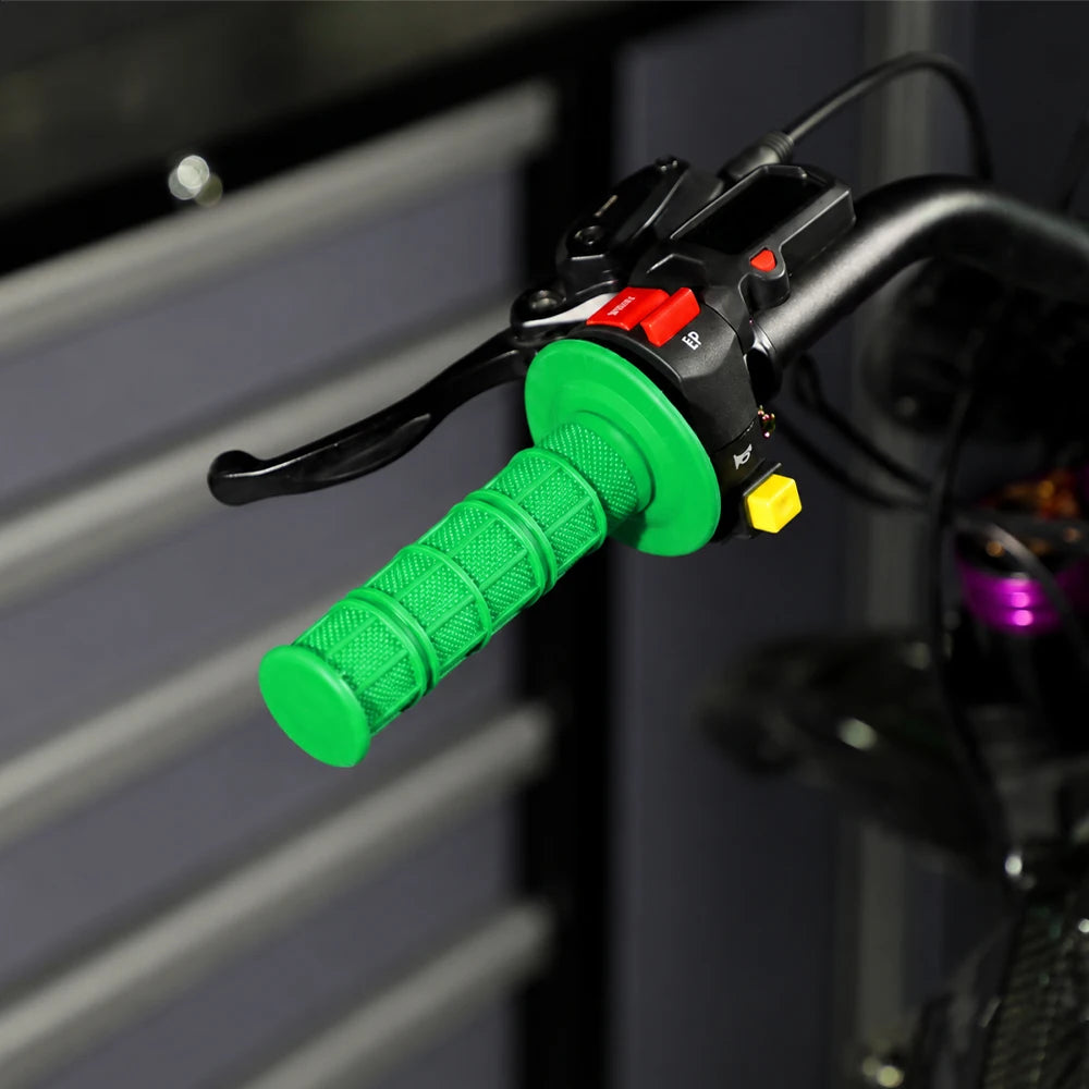 Close-up of a green silicone handle bar grip for a motorcycle, showing the textured surface and mounting mechanism.