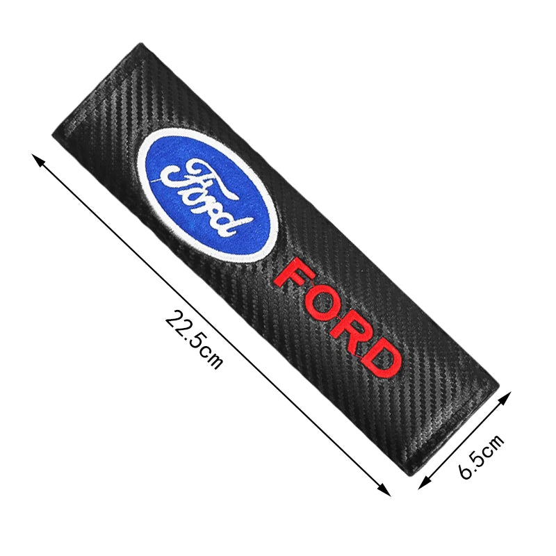 Black carbon fiber seat belt shoulder pad cover with a blue Ford logo and red FORD text