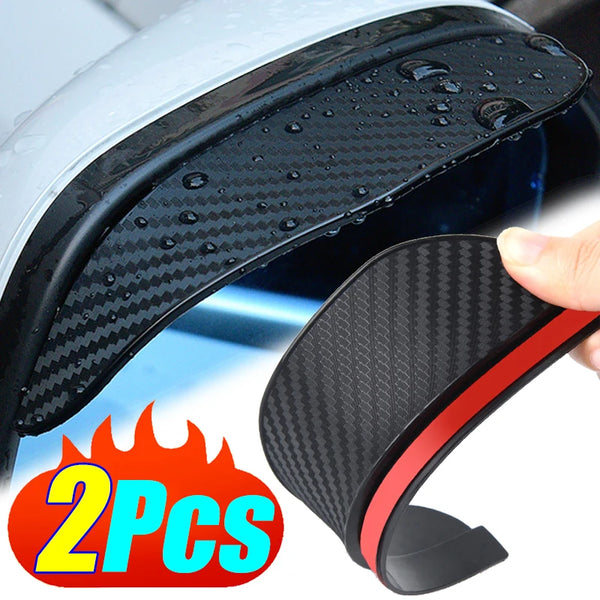 Two black carbon fiber rain shields for car rearview mirrors shown in close-up
