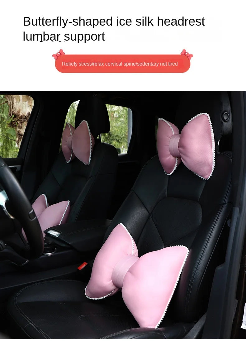 Butterfly-shaped ice silk headrest lumbar support pillow with a pink bow design installed in a car seat.