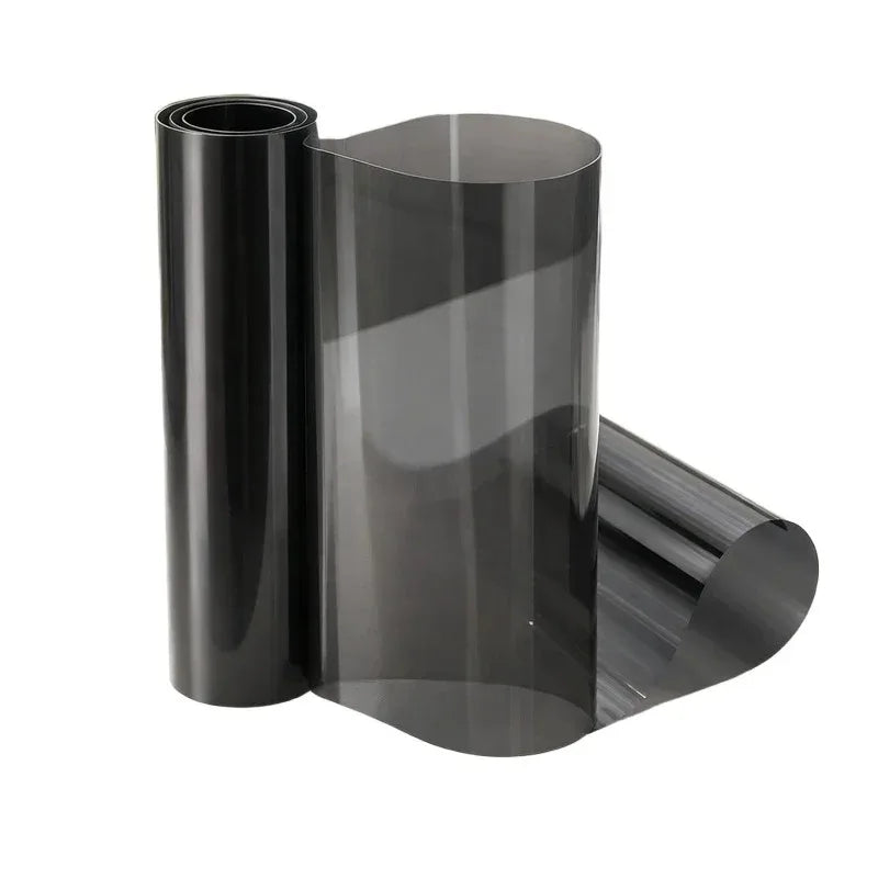 Roll of dark gray automotive tint film for headlights and taillights