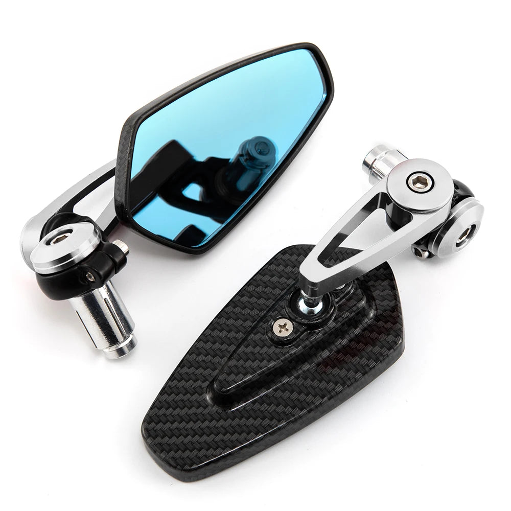 A pair of aluminum handlebar side motorcycle rearview mirrors, one clear and one tinted blue.